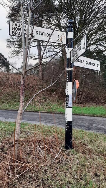 Cumberland County Council finger signpost at cross roads at south end of Faugh