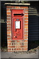 SU8368 : Benchmark on letter box at Plough Lane / London Road junction by Roger Templeman