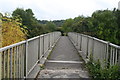 SK0281 : Footbridge over A6 by Dave Dunford