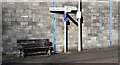 NY4758 : Finger signpost and wooden seat at T-junction in Newby East by Luke Shaw