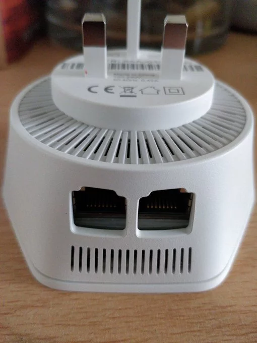 A plug in unit with two ethernet ports.