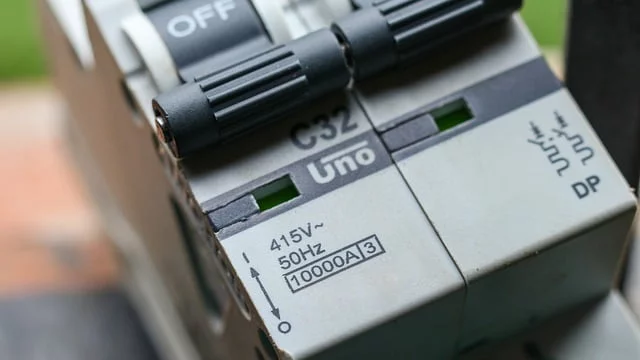 Photo of an MCB - a small electrical switch. It is in the off position.