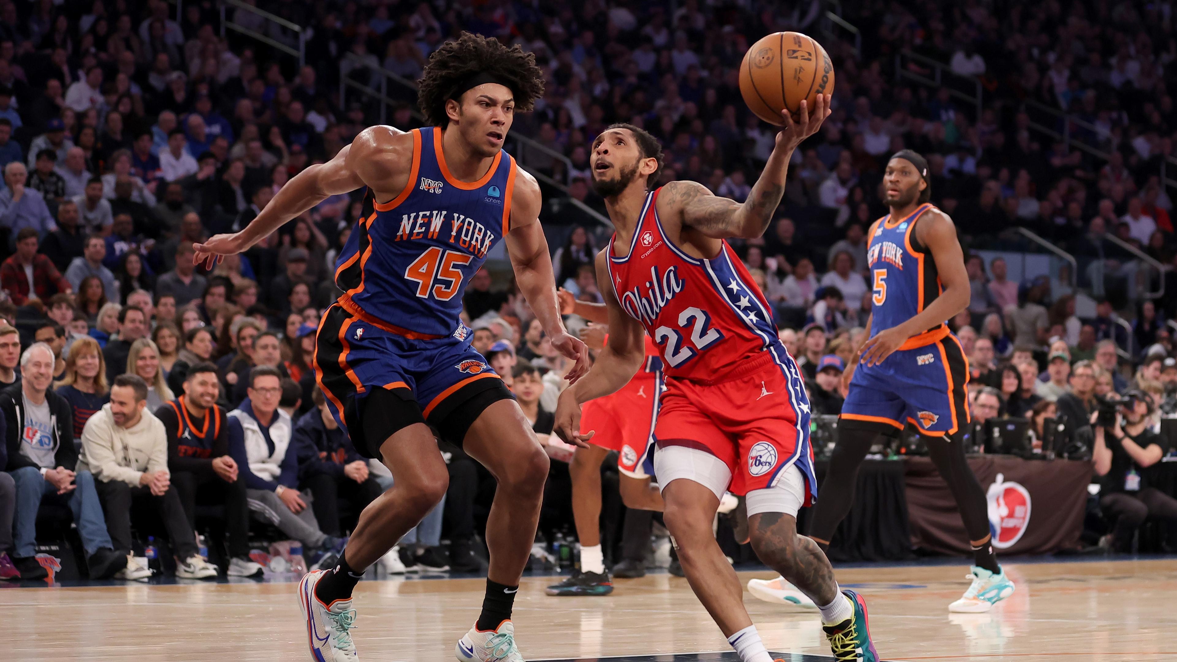 Mar 10, 2024; New York, New York, USA; Philadelphia 76ers guard Cameron Payne (22) drives to the basket against New York Knicks center Jericho Sims (45) and forward Precious Achiuwa (5) during the second quarter at Madison Square Garden. Mandatory Credit: Brad Penner-Imagn Images