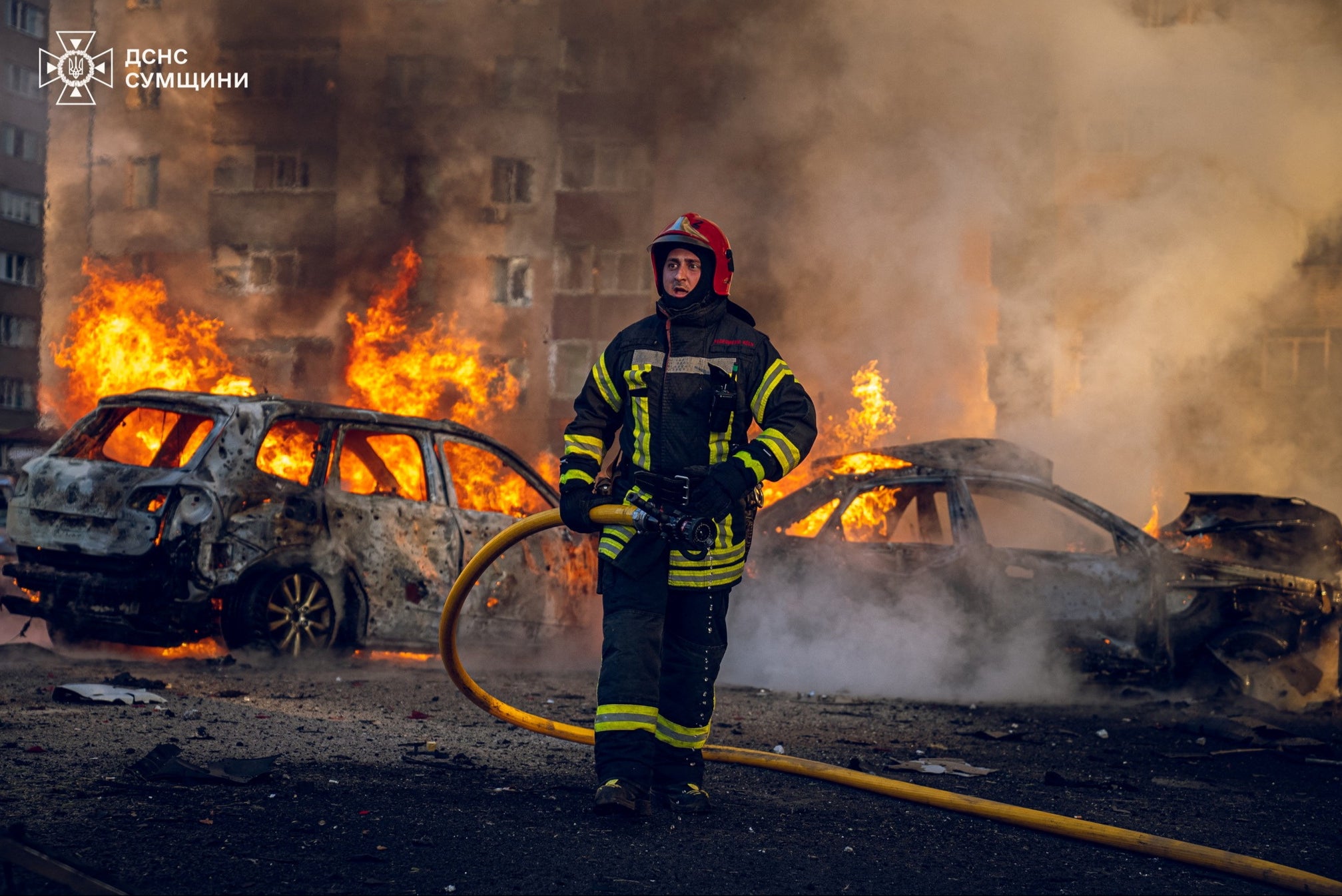 A firefighter works at the site of a Russian missile strike in Sumy