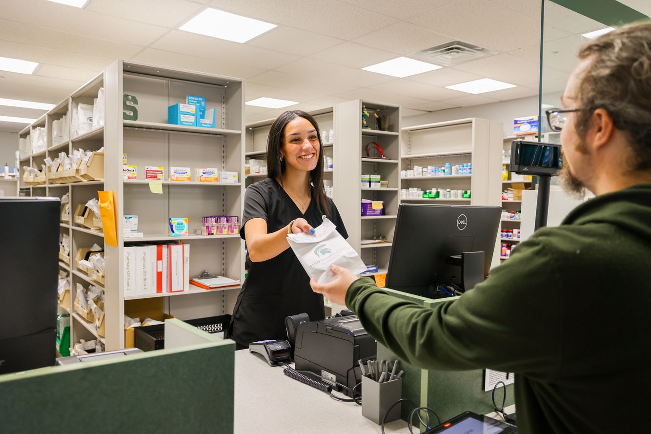 Technician assisting patient