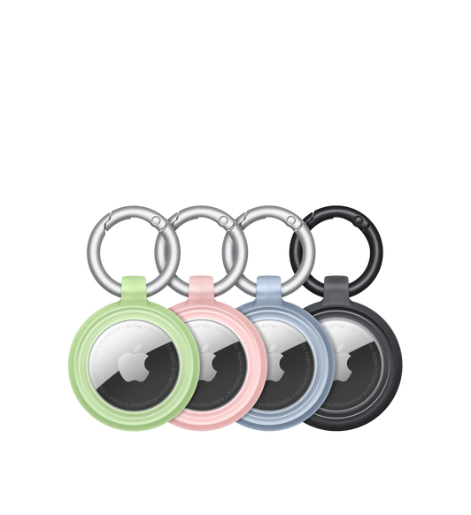 Čtyři kryty OtterBox Lumen Series s vloženými AirTagy, na kterých je zřetelně vidět logo Apple