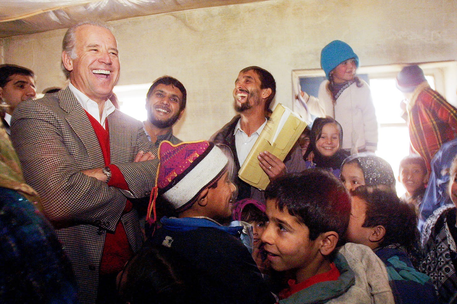 399542 02: U.S Senator Joseph Biden,Chairman of the Senate Foreign Relations Committee meets with a Afghan students at Ariana High school January 12, 2002 during his visit to Kabul, Afghanistan. (Photo by Paula Bronstein/ Getty Images)