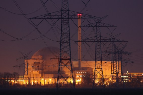 Electricity pylons stand in a row leading to the Unterweser nuclear power plant.