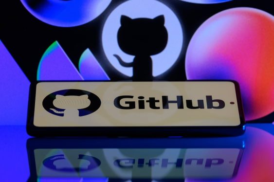 The GitHub logo is being displayed on a smartphone