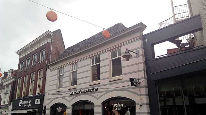 File:Cheese decorations hanging between shops, Gouda (2019) 02.jpg