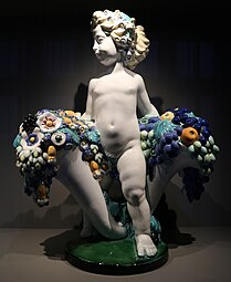 Secessionist putto with two cornucopias with floral cascades, by Michael Powolny, designed in c. 1907, produced in 1912, ceramic, Kunstgewerbemuseum Berlin[14]