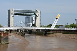 A large lifting structure, providing a tidal barrier over a river