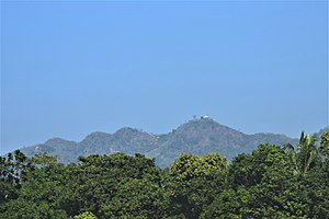 Chandranath Hill, as seen from the Dhaka-Chittagong railroad. It is the tallest peak in Chittagong district, and is the location of Chandranath and Birupakkha temples.