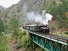 A Šargan Eight train approaching the line's longest bridge in 2003