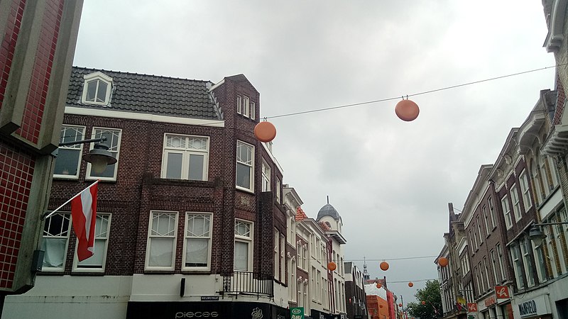 File:Cheese decorations hanging between shops, Gouda (2019) 03.jpg