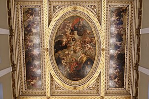 On a painted ceiling, angels surround a king dressed in red.