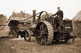 Traction engine driving a Marshall threshing machine