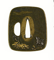 Tsuba (pieza de la funda d'una espada) en bronce, oru y plata representando a un "coneyu mirando pa la lluna de la seronda" (1670-1744).