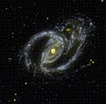 NGC 1097, una galassia a spirale con i bracci molto aperti nella costellazione della Fornace.