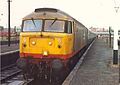 A Class 47 (no. 47373) in revised Railfreight red stripe livery.