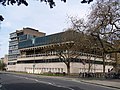 The Denys Wilkinson Building from the Banbury Road on the corner with Keble Road, looking north with the Thom Building in the background.