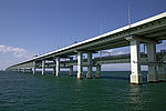 Sky Gate Bridge R at Kansai International Airport, Osaka, Japan, is the longest double-decked truss bridge in the world. It carries three lanes of automobile traffic on top and two of rail below over nine truss spans.