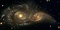 La Galassia Vortice, una galassia in via di interazione con una galassia più piccola.