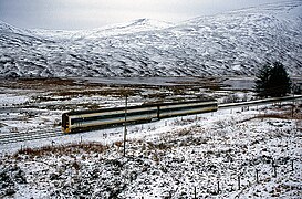 158703 heads through the Drumochter Pass in the snow