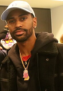 Big Sean looking aside.