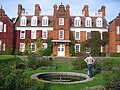 Sidgwick Hall and the sunken garden of Newnham College.