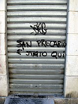"San Precario è stato qui" / "Saint Precariuos worker was here".
