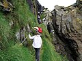 Ropes are fastened to the cliff for better safety. This is the only was up to the island from the sea.