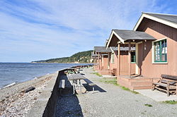 The island's western beach at Cama Beach State Park