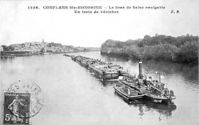 Chain boat towing barges on the Seine. It pulls itself upstream using a chain laid along the riverbed.