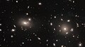 Thousands of globular clusters lying at the core of a galaxy cluster.[25]