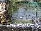 Detail of carving on right-hand (facing temple) wall of Mask Temple. A similarly sized panel on the left-hand side is covered up for its protection.