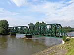 Side view of the iron truss railway bridge over Mura River in Mursko Središće, Croatia