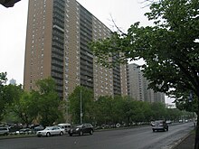 High-rise buildings on Ocean Parkway. In the foreground is the parkway's main road, flanked by trees.