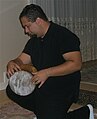 Man playing a doumbek