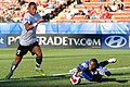 Austria v. Congo, Congolese goalkeeper saving a shot from inside the penalty area.