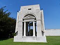 Shelter forming the left wing of the memorial