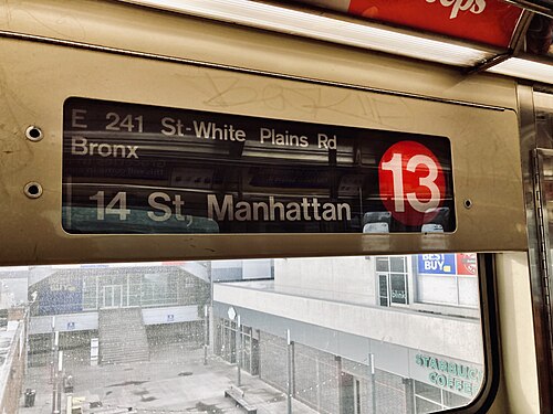 An R62A car with its side sign displaying the 13 bullet in red, corresponding to the IRT Seventh Avenue Line.