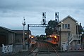 Westbound view from the Mollison Street level crossing looking at signal box, station buildings and platforms, June 2006