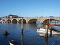 Six large arches of Cobden Bridge across the sky-reflecting estuary of the chalkland-fed Itchen