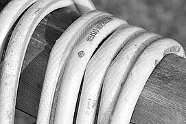 Closeup of a garden hose shows the crisscrossed fiber reinforcements