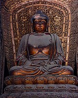 Jin dynasty (1115–1234) statue of Amoghasiddhi in Shanhua Temple in Datong, Shanxi, China, one out of a set of statues of the Five Tathagathas