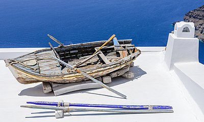 Row boat on a roof in Santorini