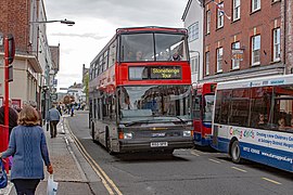 Stonehenge Tour bus passing Salisbury bus station