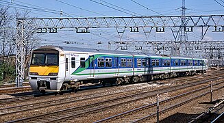 BR Class 321/3 at Pudding Mill Lane in First Great Eastern Livery, 1999