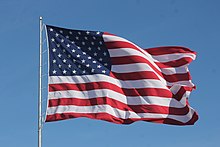 American Flag Waving on a Flag Pole.jpg